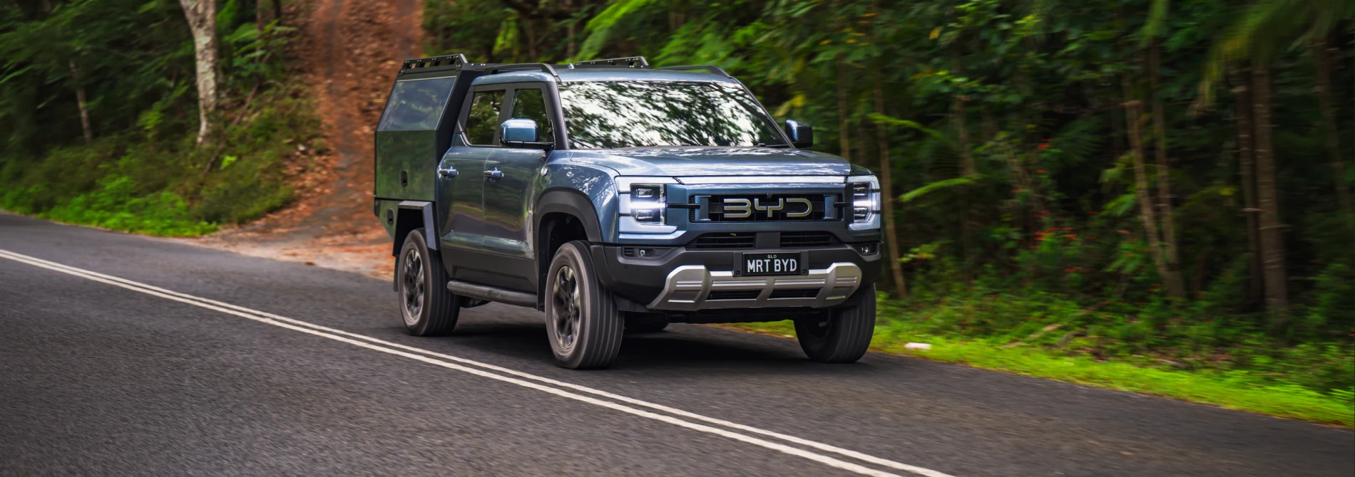 BYD Shark fitted with an MRT chassis-mount canopy driving through an Australian forest